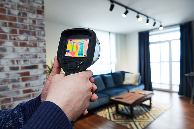 Thermal imaging device used while preforming home inspection services 